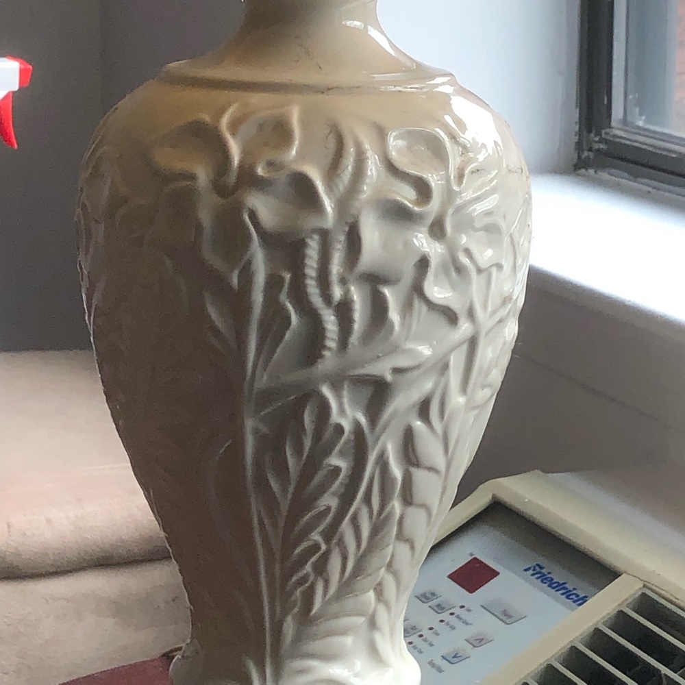 2 lamps. White design with gold trim base.
